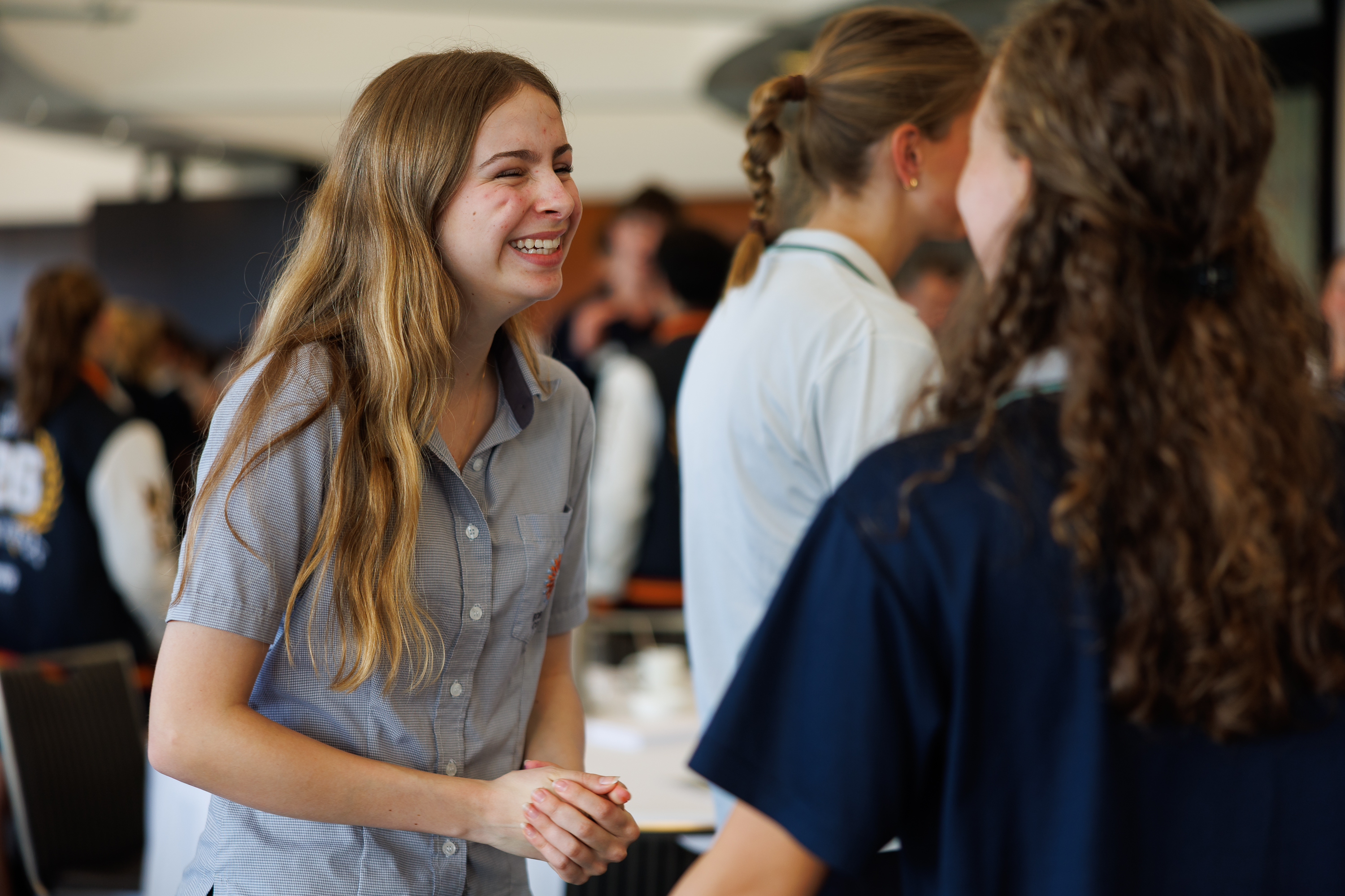 Young people talking and collaborating at a table during a project session